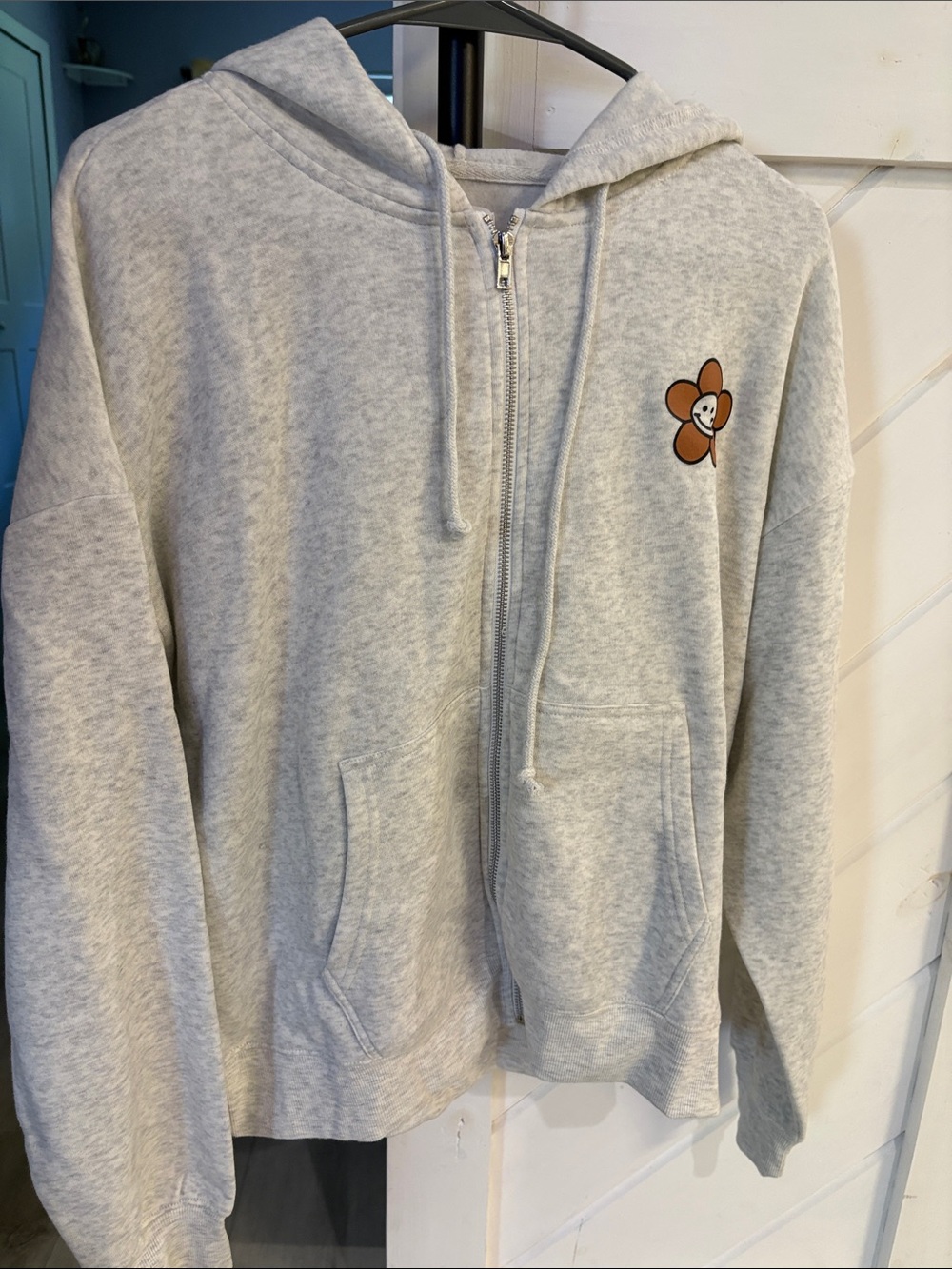 Light Gray Zip-Up Hoodie with Brown Flower Patch